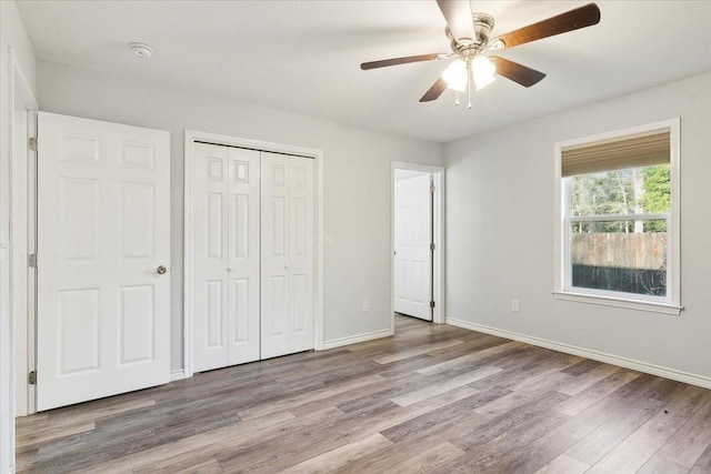 unfurnished bedroom featuring ceiling fan and light hardwood / wood-style floors