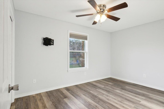 unfurnished room with ceiling fan and hardwood / wood-style floors