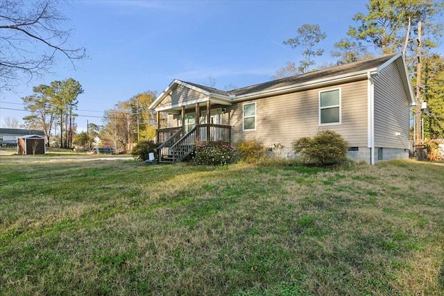 exterior space featuring covered porch and a lawn