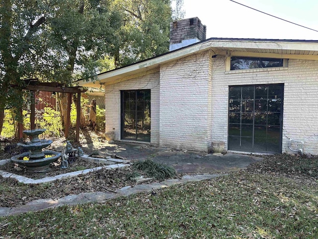 view of side of property featuring central AC