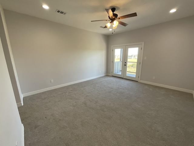 empty room featuring carpet flooring, ceiling fan, and french doors