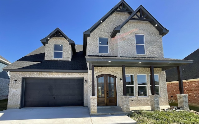 view of front of home featuring french doors and a garage