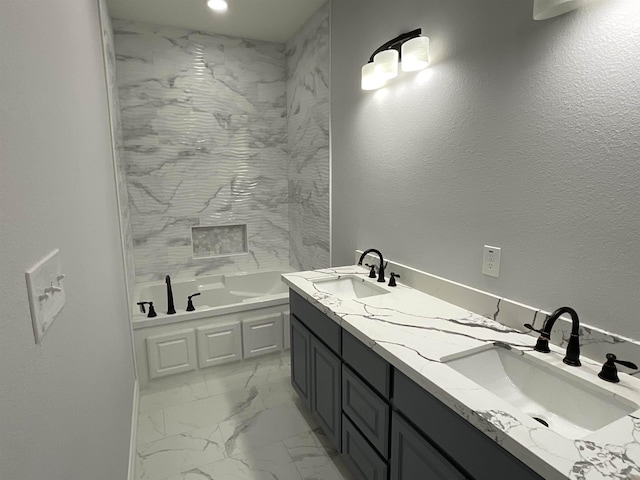 bathroom featuring vanity and a tub to relax in