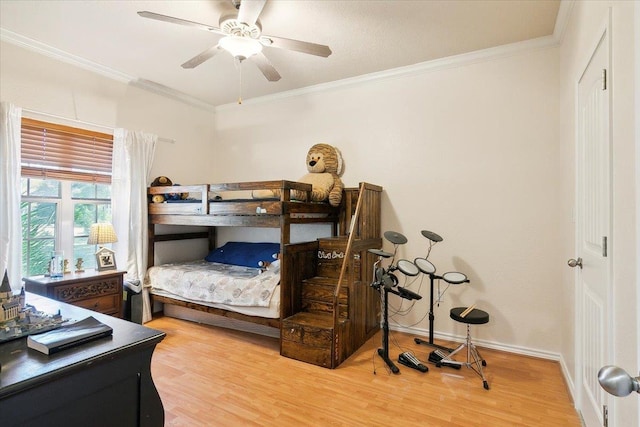 bedroom with ceiling fan, light wood-type flooring, and ornamental molding