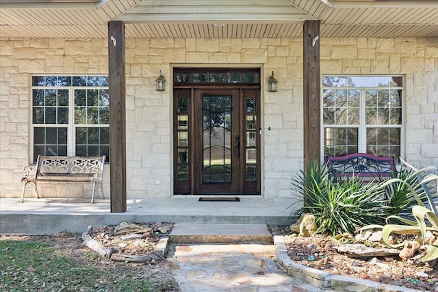 property entrance with covered porch