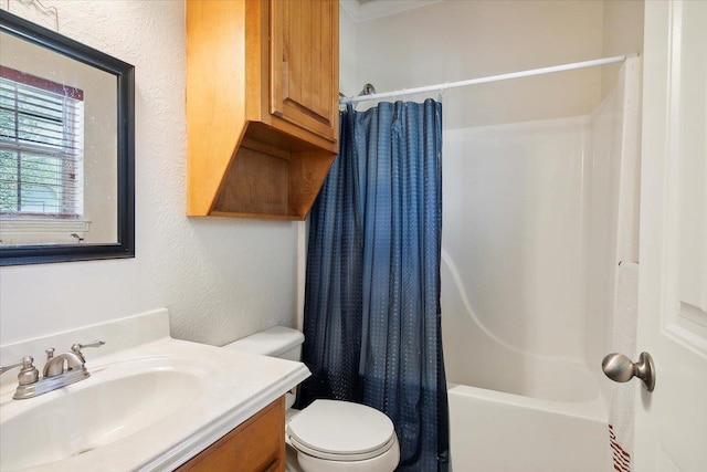 full bathroom featuring vanity, shower / bath combination with curtain, and toilet