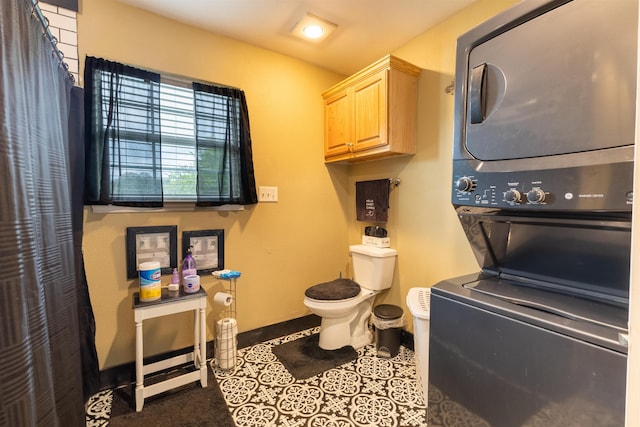 2315 Granger Dr, Bridge City, TX 77611 - laundry area featuring stacked washer / drying machine and baseboards