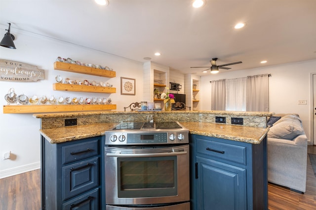 2315 Granger Dr, Bridge City, TX 77611 - kitchen with stainless steel electric range oven, blue cabinetry, open floor plan, dark wood finished floors, and recessed lighting
