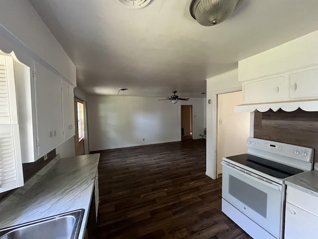 kitchen featuring dark hardwood / wood-style floors, sink, white cabinets, white electric range oven, and ceiling fan