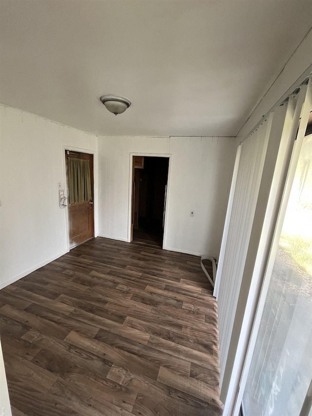 spare room featuring dark hardwood / wood-style flooring