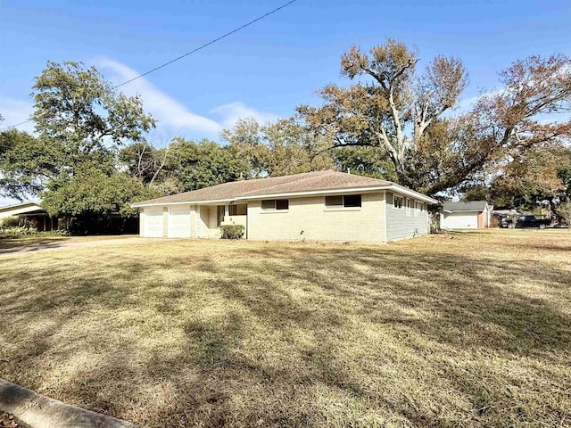 exterior space with a garage and a front yard