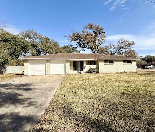 ranch-style house featuring a garage and a front yard