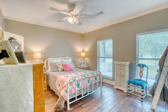 bedroom featuring dark hardwood / wood-style floors, ceiling fan, and ornamental molding