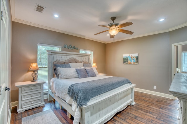 bedroom with dark hardwood / wood-style floors, ceiling fan, and ornamental molding