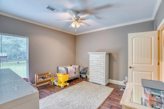 bedroom featuring ornamental molding, ceiling fan, and dark wood-type flooring