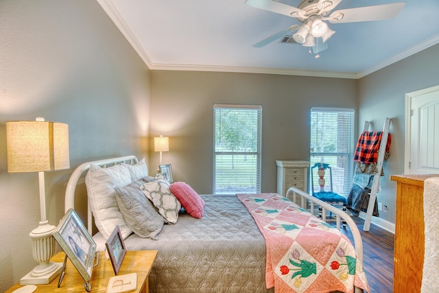 bedroom with hardwood / wood-style flooring, ceiling fan, and ornamental molding