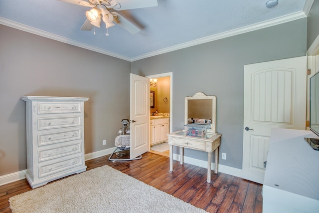 bedroom featuring connected bathroom, dark wood-type flooring, ceiling fan, and crown molding