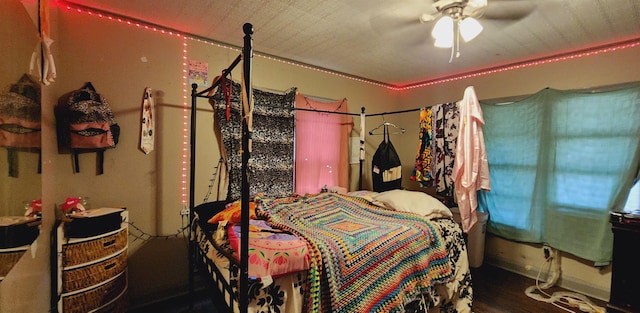 bedroom with wood-type flooring and ceiling fan