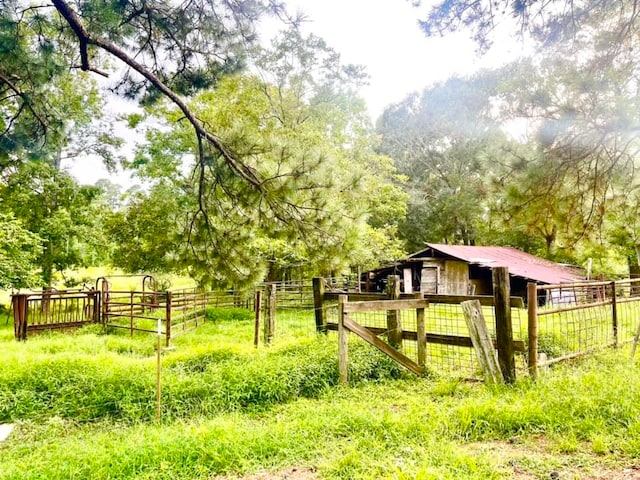 view of property's community with a rural view and an outdoor structure