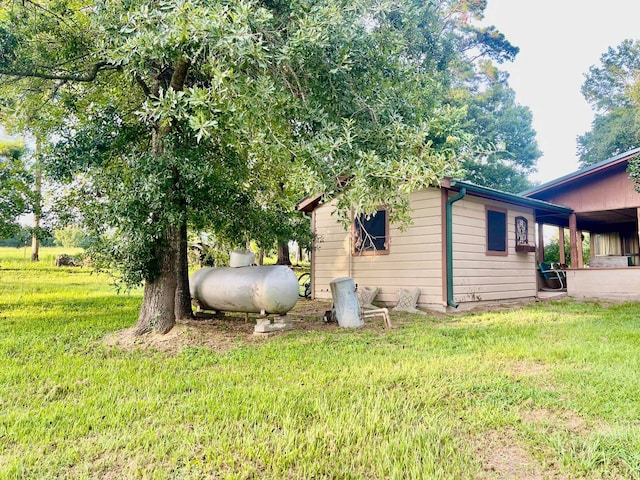 view of home's exterior with a lawn