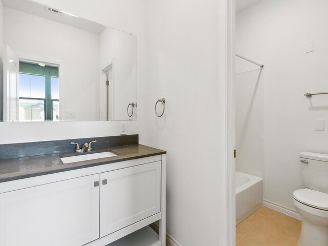 bathroom with tile patterned flooring, visible vents, baseboards, toilet, and vanity