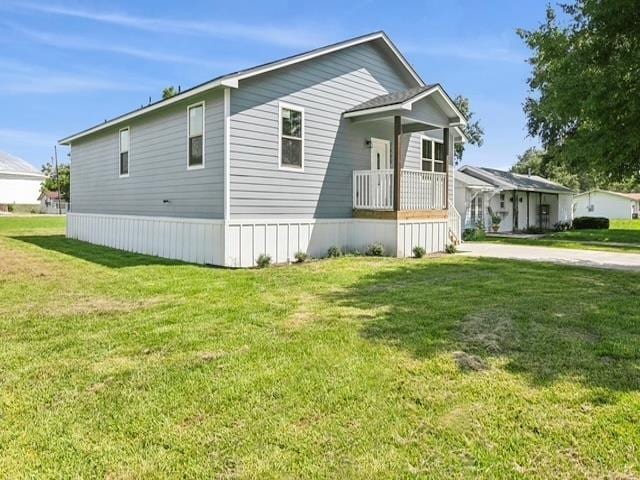 view of property exterior featuring a lawn