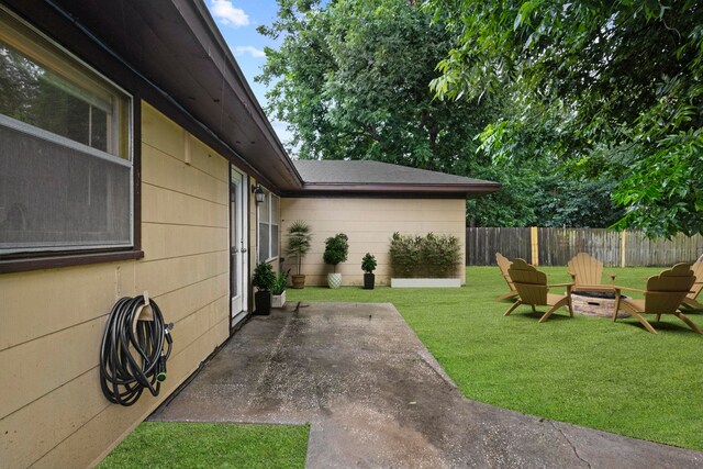 3449 Charles Ave, Groves, TX 77619 - view of yard featuring an outdoor fire pit and a patio