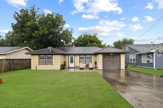 3449 Charles Ave, Groves, TX 77619 - ranch-style house with asphalt driveway and a garage