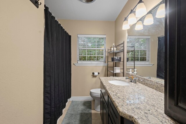 3449 Charles Ave, Groves, TX 77619 - full bath featuring plenty of natural light, vanity, tile patterned floors, and curtained shower