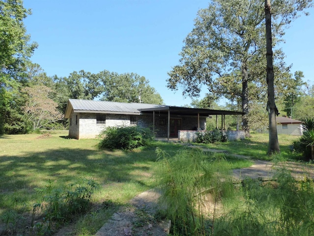 view of outbuilding featuring a yard