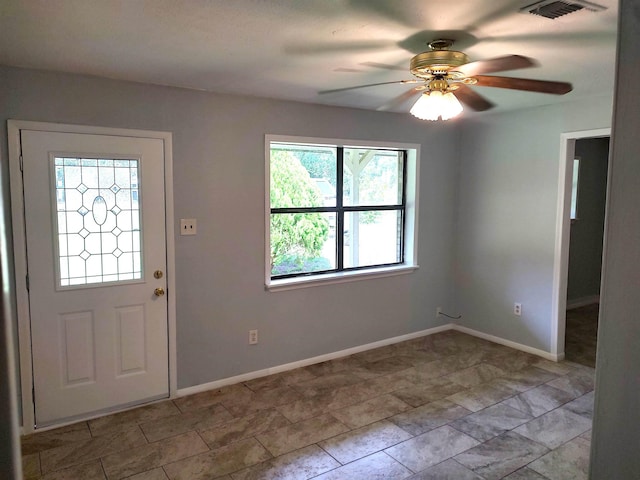 foyer entrance with ceiling fan