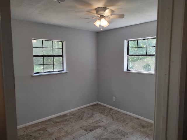 empty room featuring ceiling fan