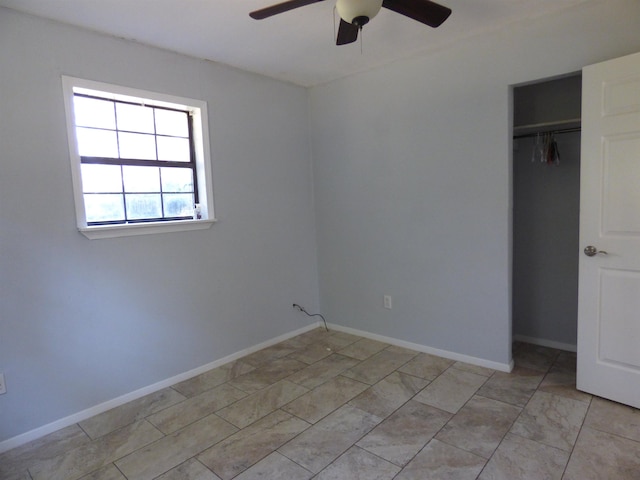 unfurnished bedroom with a closet and ceiling fan