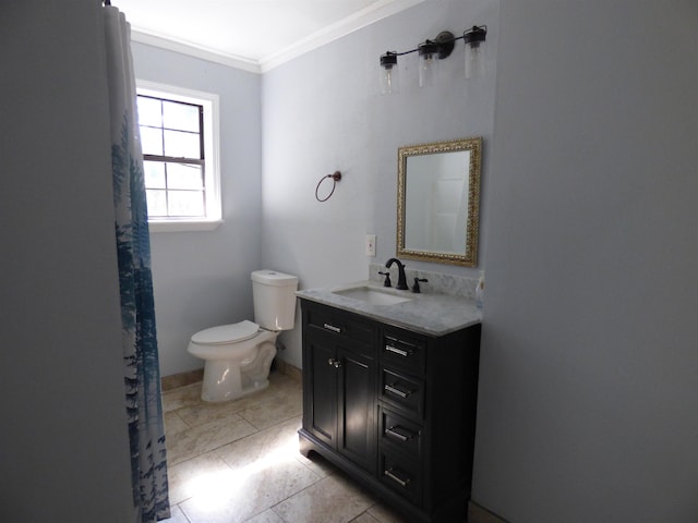 bathroom with tile patterned floors, vanity, toilet, and crown molding