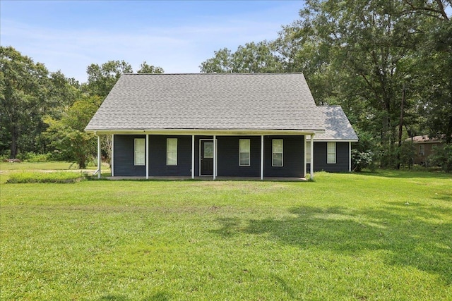 7960 Wade Rd, Orange, TX 77632 - view of front facade with a front yard and a shingled roof