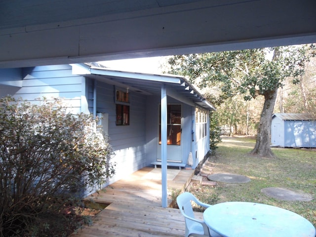 exterior space featuring a shed and a deck