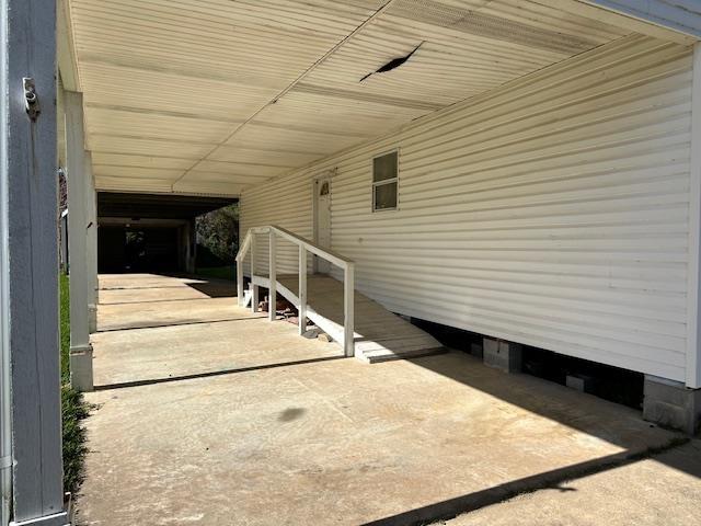 view of patio / terrace featuring a carport