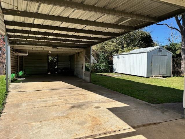 exterior space with a carport and a yard