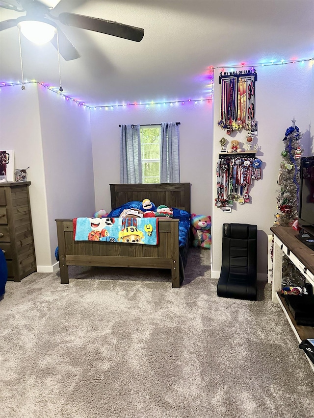 bedroom with carpet, baseboards, and ceiling fan