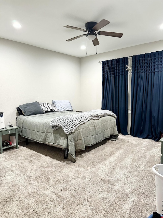 carpeted bedroom featuring recessed lighting and a ceiling fan