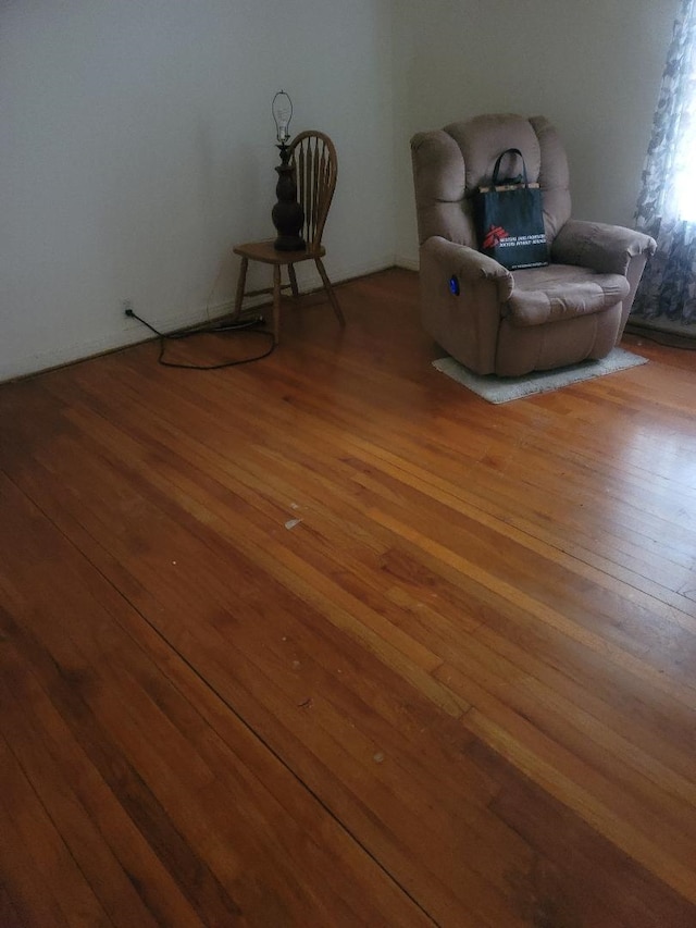 unfurnished room with hardwood / wood-style flooring