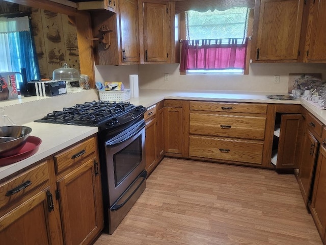 kitchen featuring light hardwood / wood-style flooring and range with gas stovetop