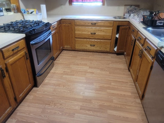 kitchen featuring light hardwood / wood-style floors, sink, and stainless steel appliances