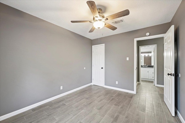2024 International Ave, Orange, TX 77632 - unfurnished bedroom featuring light wood-style flooring and a ceiling fan