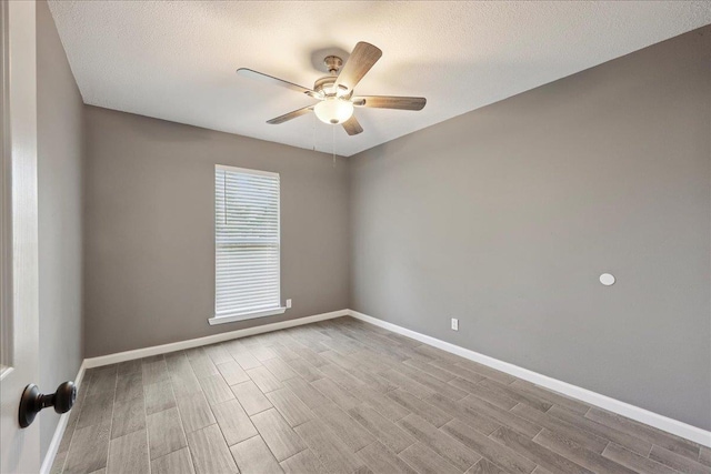 2024 International Ave, Orange, TX 77632 - empty room with a ceiling fan, wood finished floors, and a textured ceiling