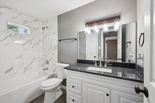 2024 International Ave, Orange, TX 77632 - bathroom featuring vanity, shower / washtub combination, and wood finished floors