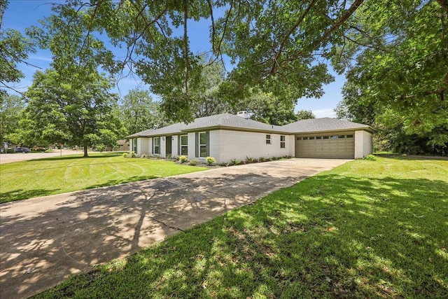 2024 International Ave, Orange, TX 77632 - view of front of property featuring driveway, an attached garage, and a front yard