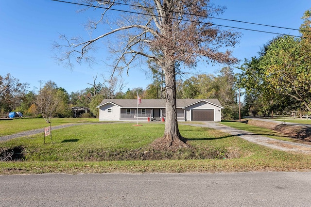 single story home featuring a garage, a front yard, driveway, and a chimney