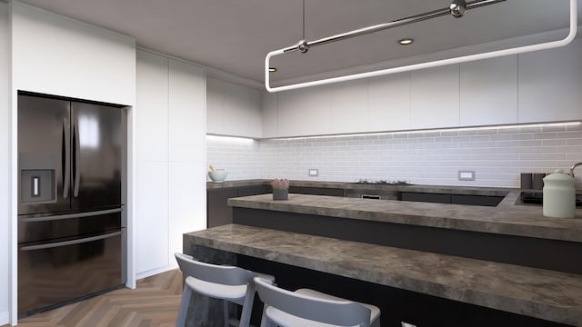 kitchen featuring black fridge and light parquet flooring