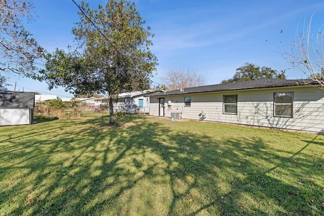 6259 Pat Ave, Port Arthur, TX 77640 - view of green lawn with a storage shed